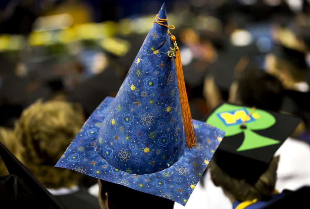 graduation cap decorated to look like a wizards cap with atomic wrapping paper