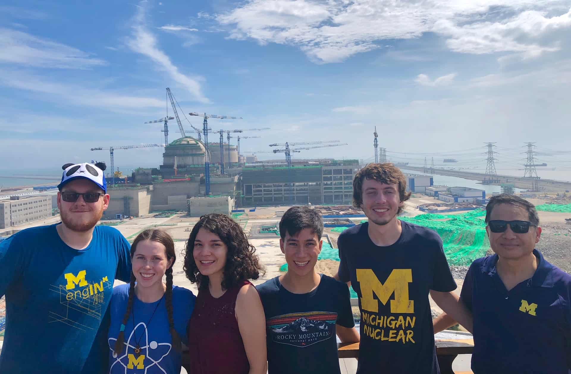 students in front of a nuclear power plant