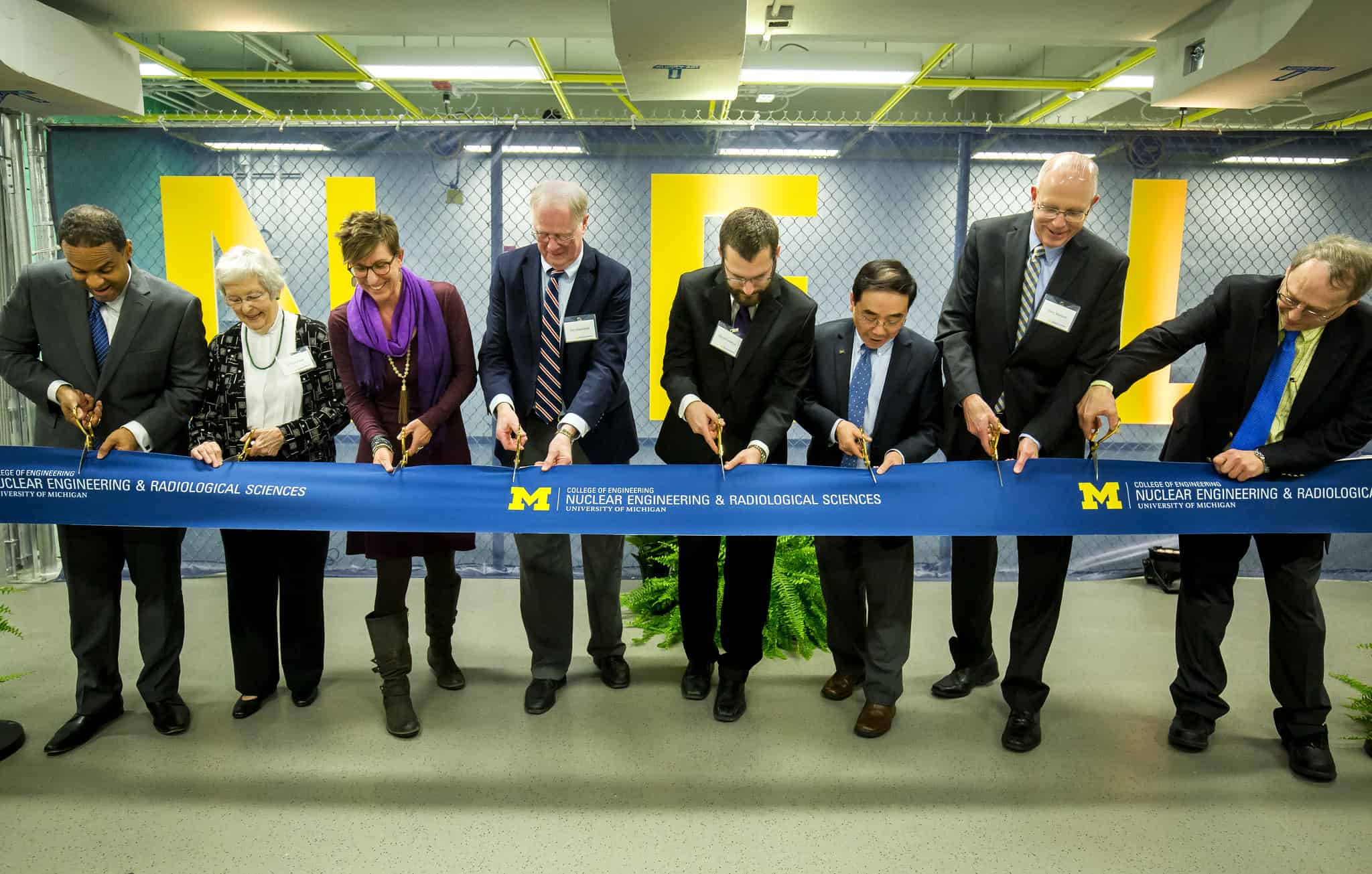 several people at a ribbon cutting ceremony