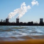 nuclear power plant towers in front of water