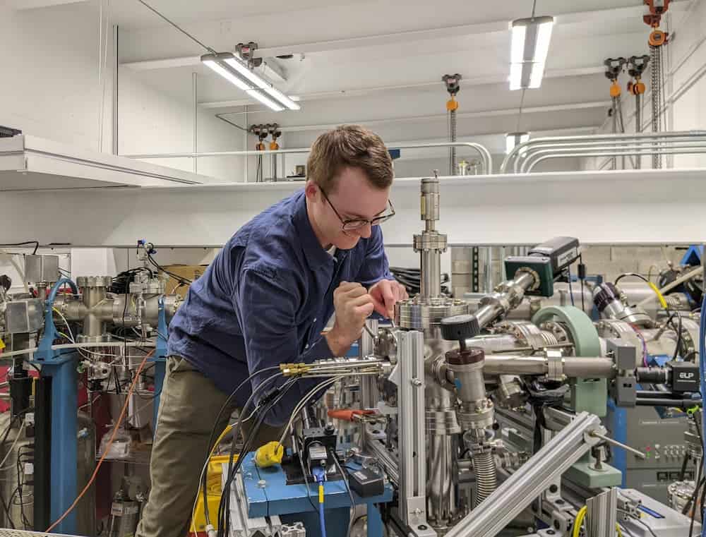 man pushes on equipment with force